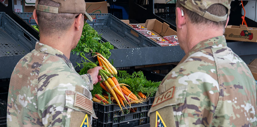 service members at farmers market