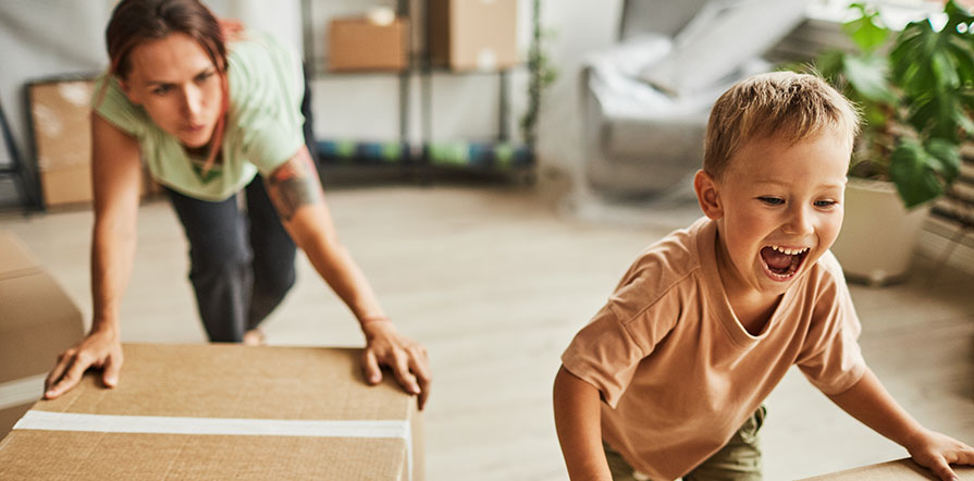 woman and child with moving boxes