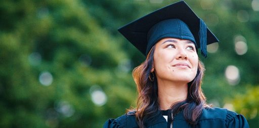 woman wearing graduation cap and gown