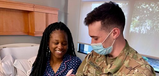 soldier with mother and newborn