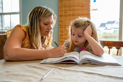 Mother homeschooling child