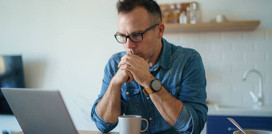 man looking at computer
