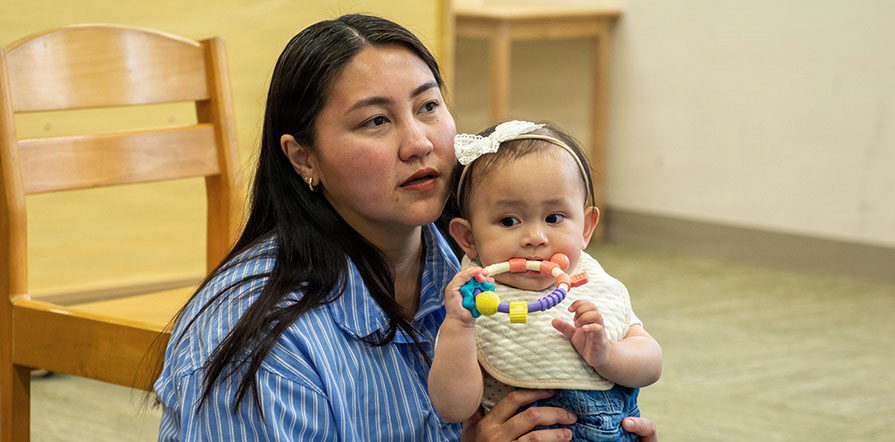 mother sits with child