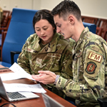 service members working together