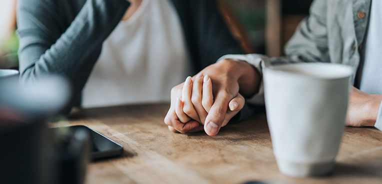 two people holding hands