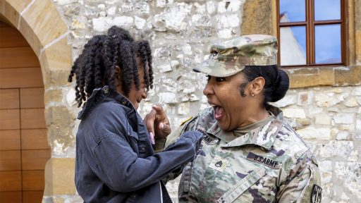 Service member plays with son